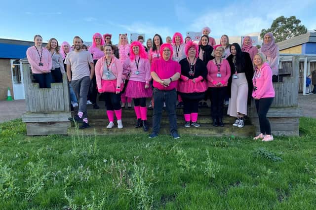 Staff and parents from Southfields school, all dressed in pink