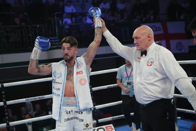 Jordan Reynolds has his arm raised after victory at York Hall on Saturday - pic: MTK Global