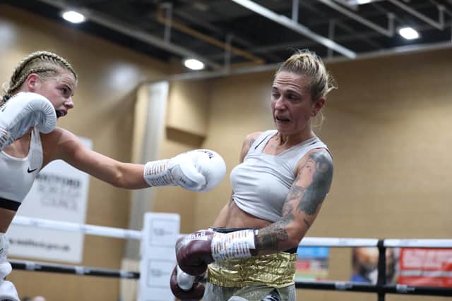 Tysie Gallagher lands a blow in her maiden fight - pic: Richard Owen (Don't Pose Photography)