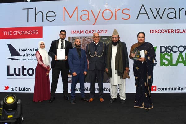 The winner, Imam Qazi Aziz, and nominated candidates for the Mayor's Award