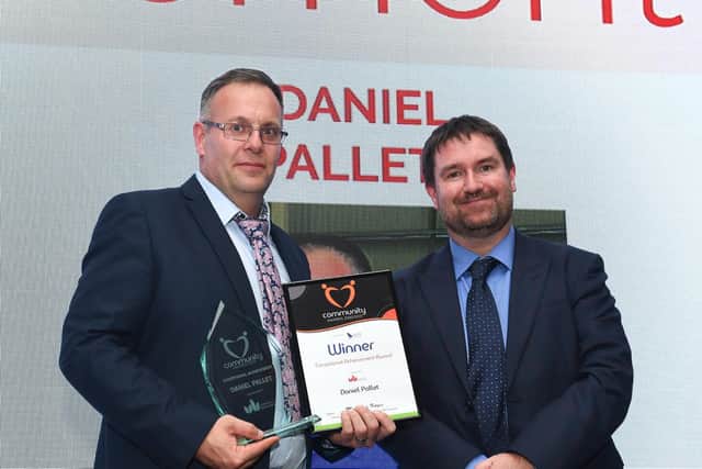 Daniel Pallett with his award