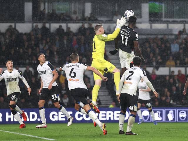 Elijah Adebayo heads home a late equaliser as Luton drew 2-2 at Derby last month