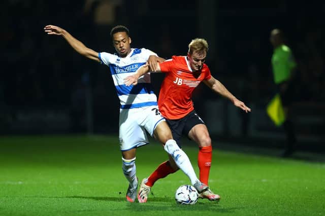 James Bree is tackled at QPR this evening