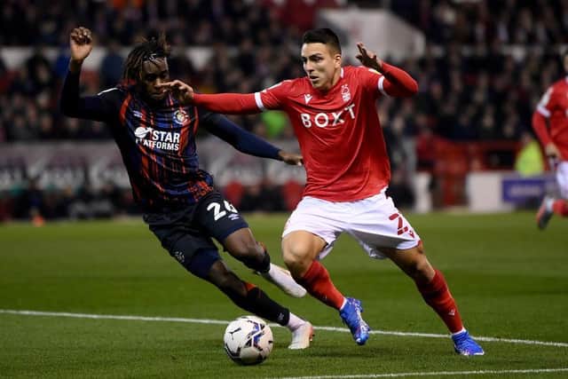 Admiral Muskwe looks to win the ball back against Forest
