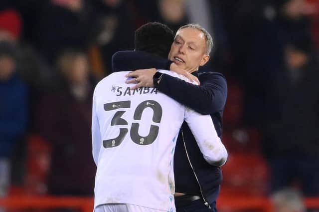 Forest boss Steve Cooper hugs keeper Brice Samba following last night's goalless draw