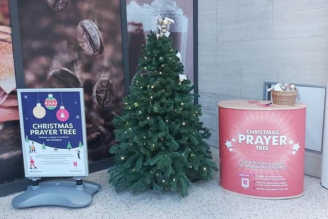 The Prayer Tree is located by H Samuel and will remain there until Christmas Eve