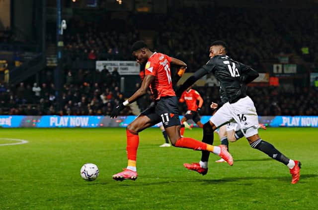 Town striker Elijah Adebayo looks to race away against Fulham on Saturday