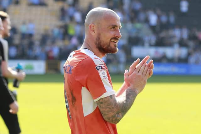 Former Luton player Alan McCormack applauds the Town supporters at Notts County during their League Two promotion-winning season