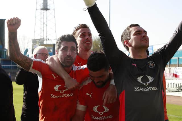 Alan Sheehan celebrates promotion from League Two with the Hatters