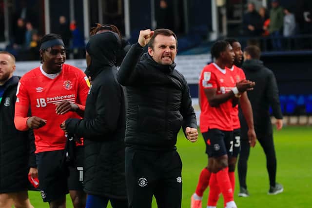 Town chief Nathan Jones celebrates a win with the Luton fans