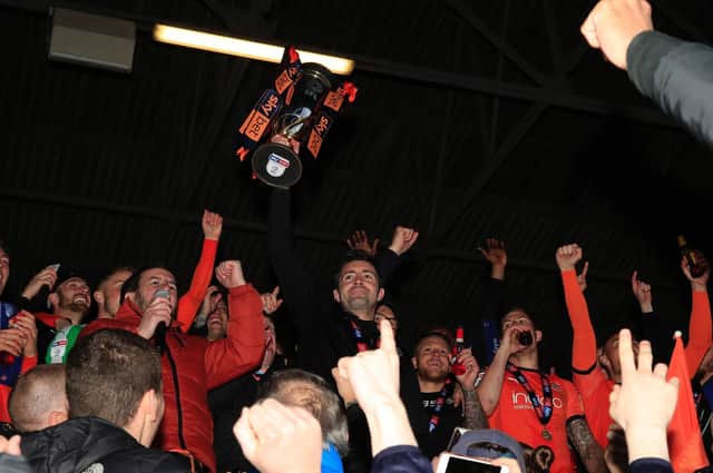 Alan Sheehan celebrates winning promotion with the Hatters in 2019