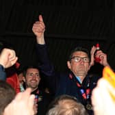 Mick Harford celebrates winning promotion to the Championship during his time as interim manager
