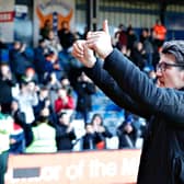 Luton assistant manager Mick Harford gives the Town fans a thumbs up at Kenilworth Road on Sunday