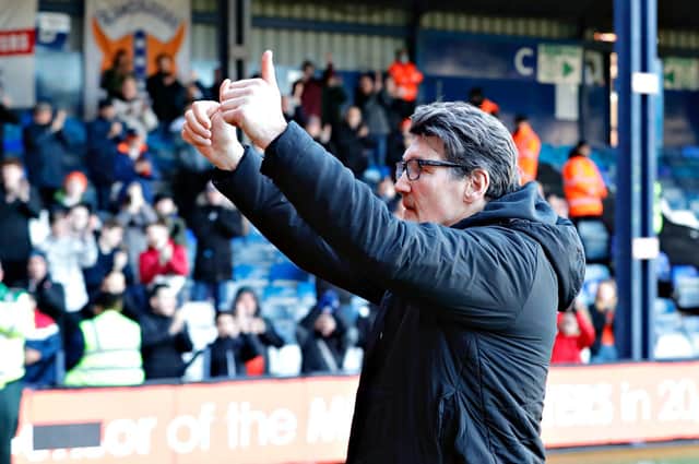 Luton assistant manager Mick Harford gives the Town fans a thumbs up at Kenilworth Road on Sunday
