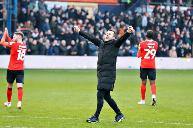 Hatters boss Nathan Jones salutes the fans after Saturday's 3-2 win over Bournemouth