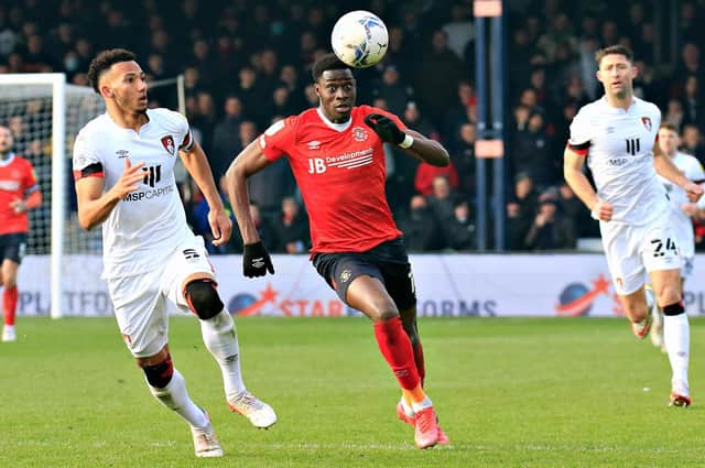 Elijah Adebayo looks to get forward against Bournemouth on Saturday
