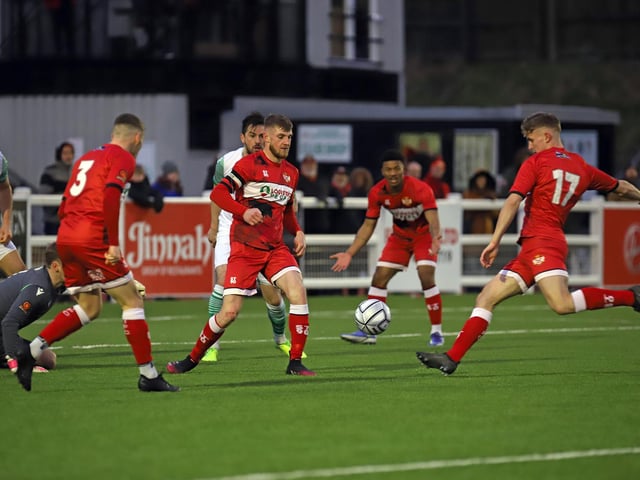 Substitute Michael Conlon lets fly with a shot for the Poppies