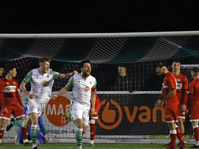 The Bradford players celebrate their stoppage-time winner
