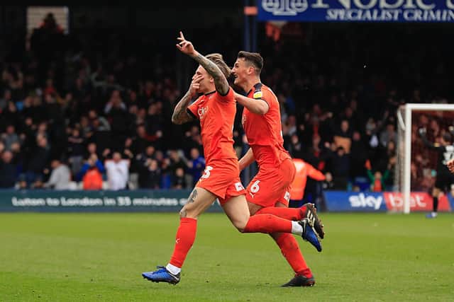 Jason Cummings celebrates scoring for the Hatters