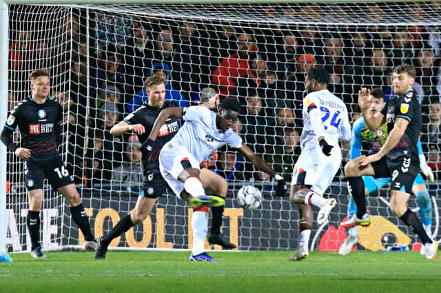Elijah Adebayo goes for goal against Bristol City