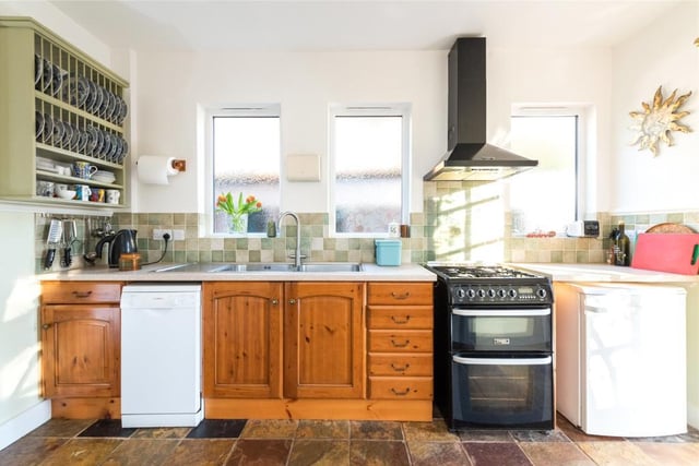 The kitchen/breakfast room is fitted with a range of pine fronted units and complementary work surfaces with space and plumbing for various free standing appliances