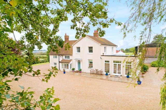 This period five bedroom former farmhouse with a detached one bedroom annexe, offers outbuildings including stables and workshops, a double carport and over 10 acres of grounds with panoramic countryside views