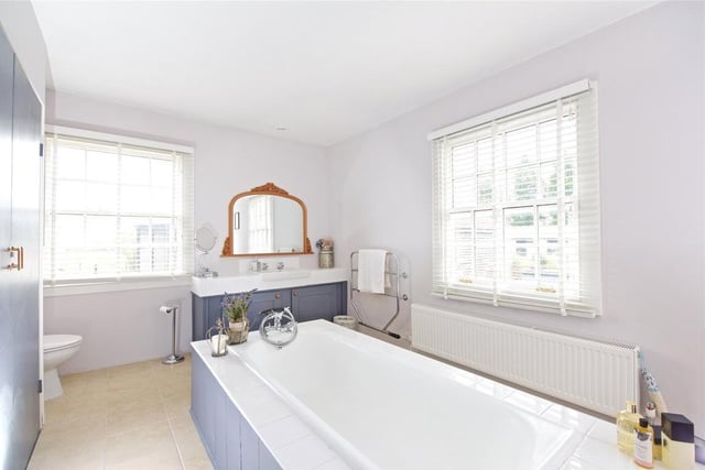 The well equipped bathroom is spacious and decorated to complement the period features of the house