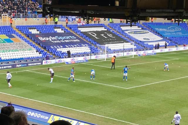 Luton's players clear the tennis balls off the pitch at St Andrew's