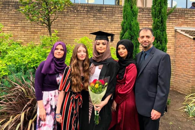 Amani with family at her graduation