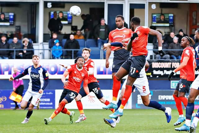 Cameron Jerome rises highest to power home his header for the Hatters