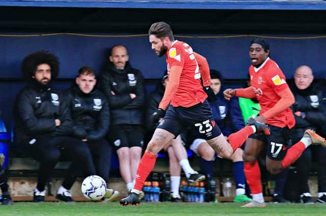 Henri Lansbury is back in to the Luton side this afternoon