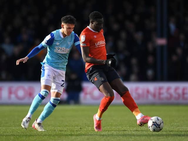 Elijah Adebayo holds the ball up against Derby on Saturday