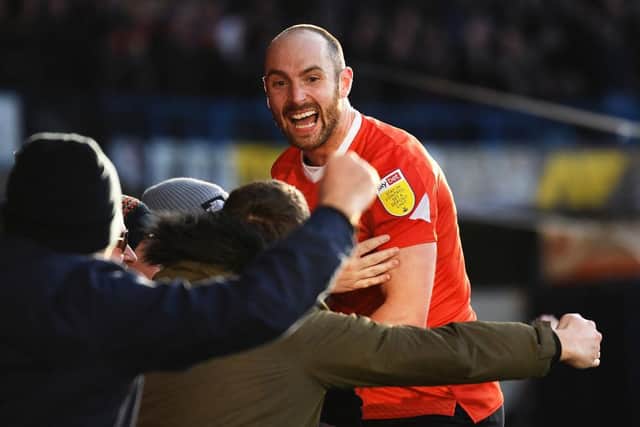 Danny Hylton celebrates his match-winning strike against Derby County