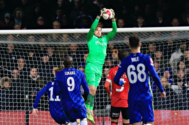 Harry Isted claims the ball against Chelsea on Wednesday night