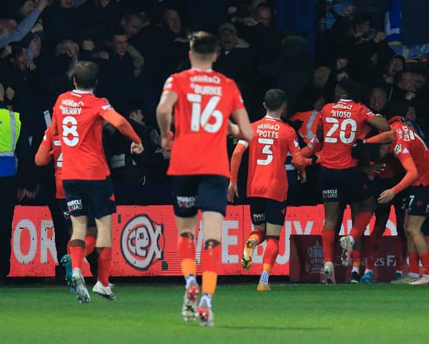 Luton's players and fans celebrate going 2-1 up against Chelsea on Wednesday night