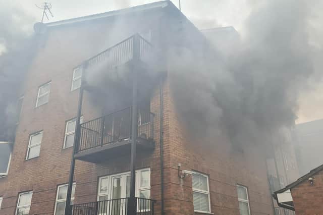The fire damaged flats in the building - Photo BFRS