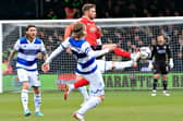 Jordan Clark nips in to win the ball for Luton