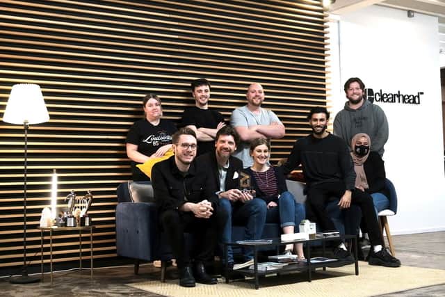 Clearhead team members celebrate the launch of their 15th birthday celebrations and pose with their London Live Film Award. From left back and clockwise: Courtney McMahon, Alex Lawrence, Cameron Stolber, Gavin O’Brien, Kat Brown, Stefan Christopher, Adam Haq, Chris Galvin, Shubi Begum
