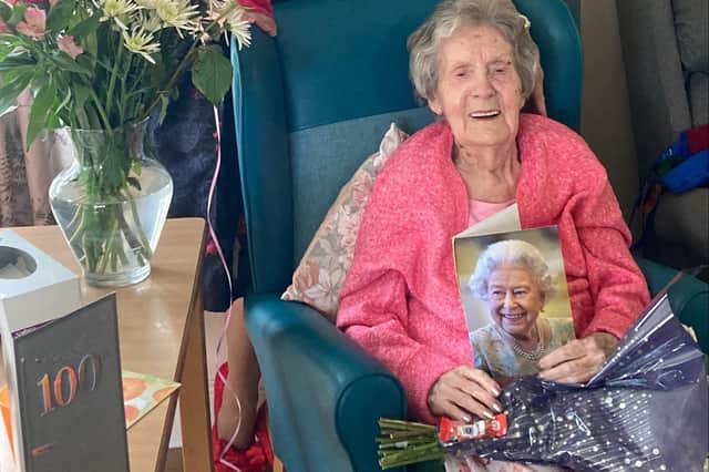 Louisa Pearson with her treasured birthday card from the Queen