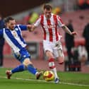 Glen Rea slides in during his debut for Wigan Athletic in the FA Cup defeat to Stoke