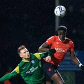 Elijah Adebayo wins a header during last night's 4-0 win over Preston