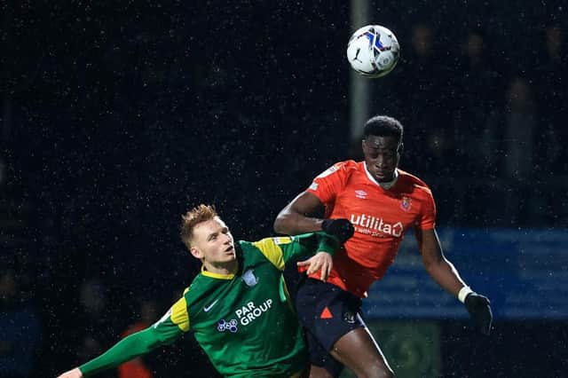 Elijah Adebayo wins a header during last night's 4-0 win over Preston
