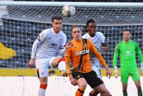 Town defender Dan Potts clears the danger against Hull - pic: Gareth Owen