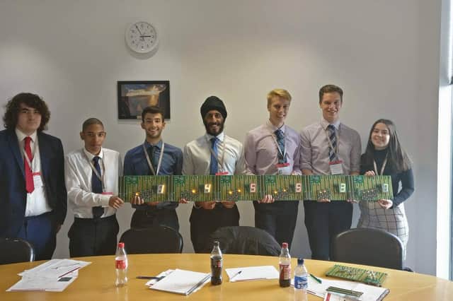 Alex (third from left) as a work experience student