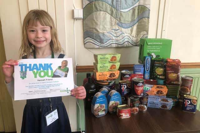 Hannah Friend with her food donations