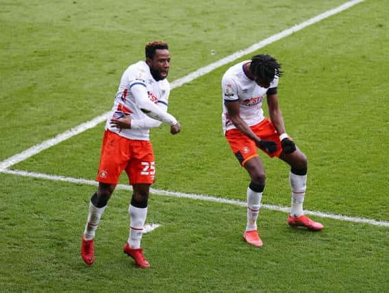 Elijah Adebayo celebrates his goal with team-mate Kazenga LuaLua