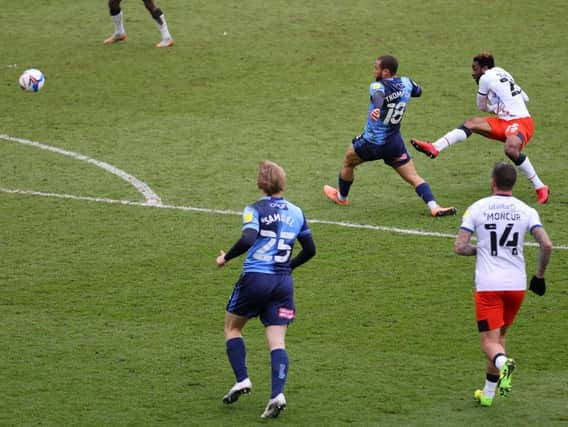Kazenga LuaLua scores his stunning strike against Wycombe on Saturday