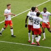 Luton's players celebrate with Elijah Adebayo after the forward made it 3-1 on Saturday
