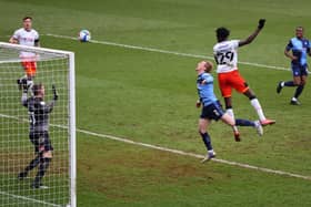 Elijah Adebayo heads home Luton's third goal at Wycombe on Saturday