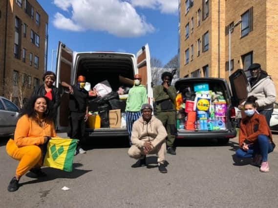 (Left to right), Kandi Sharma, Shirley Small, Ryan Lewis, Aiden Lewis, Bernie Abby, Kaleem Lewis, Melodie Nanton and Ken Young with two vans of donations received in 48 hours